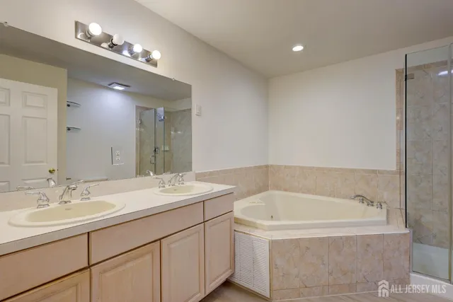 a dining room with furniture a chandelier and wooden floor