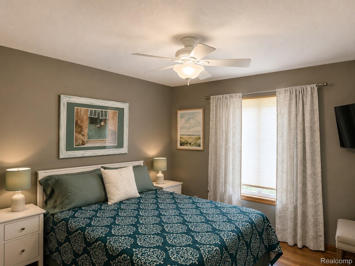 2495 North Custer Road Monroe, MI 48162 - Photo 15 of 44 Bedroom featuring a ceiling fan with integrated lighting, a window with blinds, and wood-finish flooring