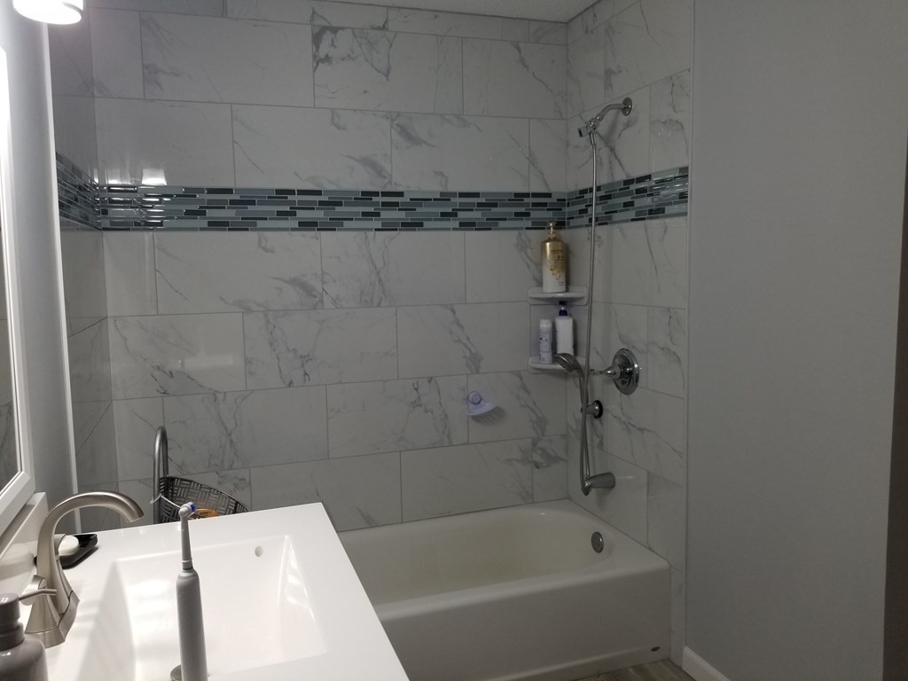 32 Maple Crest Circle, Unit B Holyoke, MA 01040 - Photo 10 of 12 a bathroom with a sink and a bathtub