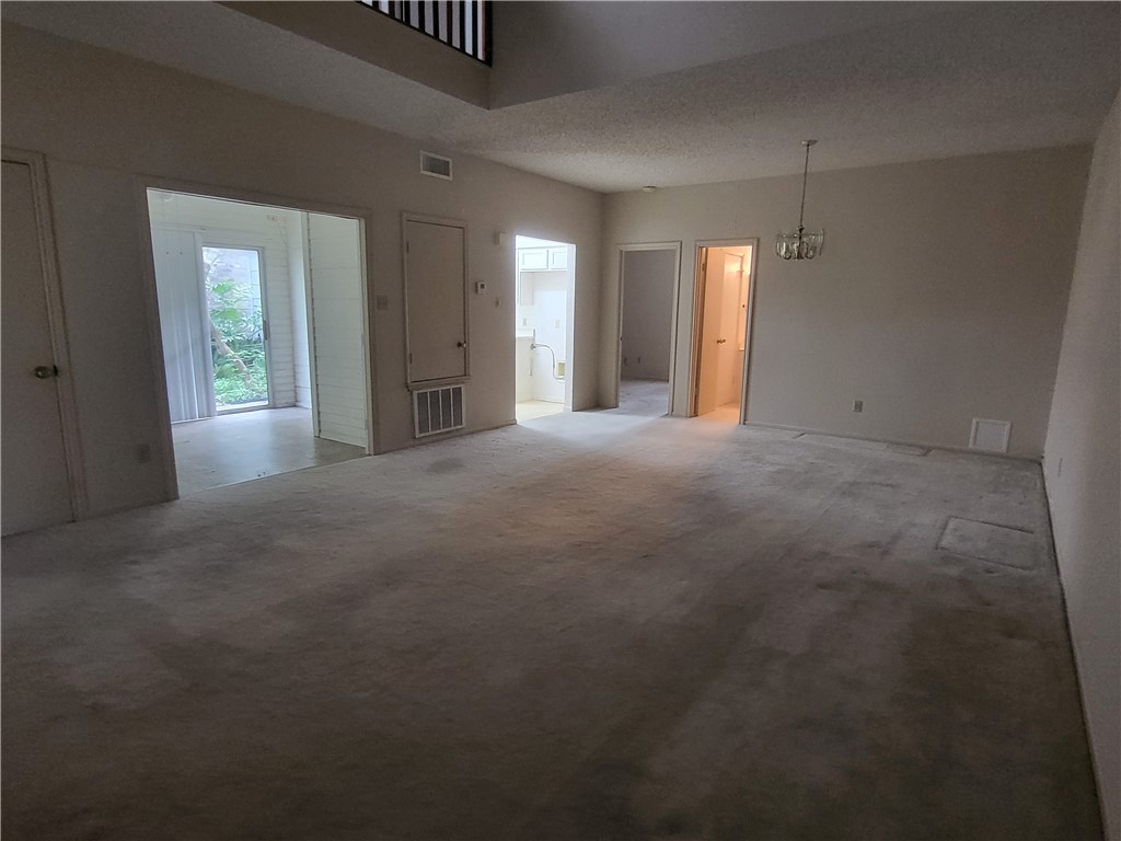 3025 Quail Springs Road, Unit L2 Corpus Christi, TX 78414 - Photo 7 of 19 a view of empty room with windows