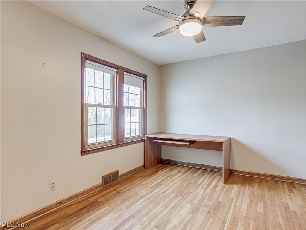 2425 Amesbury Road Akron, OH 44313 - Photo 28 of 42 Spare room featuring light hardwood / wood-style flooring and ceiling fan