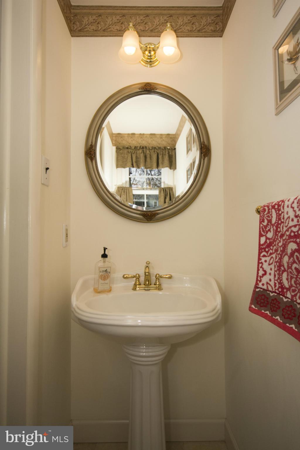 64 Belfast Road Lutherville-Timonium, MD 21093 - Photo 21 of 30 Lower Level Powder Room w/Pedestal Sink