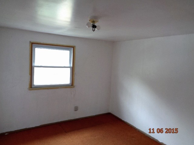292 West Cermak Road Braidwood, IL 60408 - Photo 17 of 25 an empty room with a window