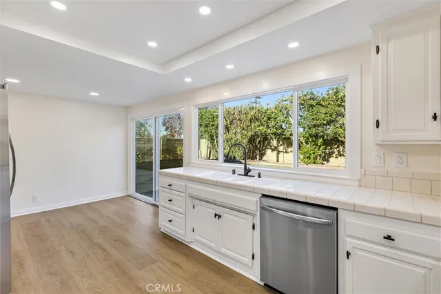 a kitchen with a sink and large window