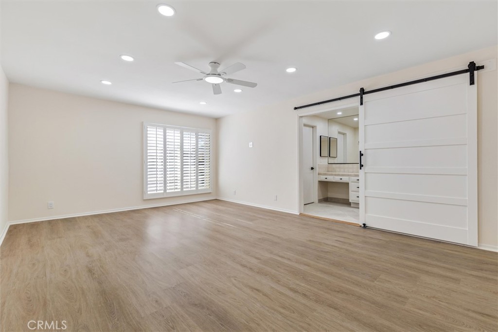 4533 Ironwood Avenue Seal Beach, CA 90740 - Photo 17 of 24 a view of empty room with wooden floor and window
