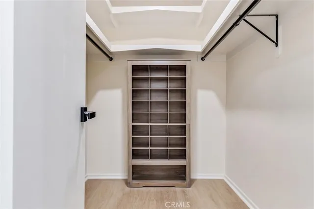 a bathroom with a granite countertop sink a toilet and a large mirror