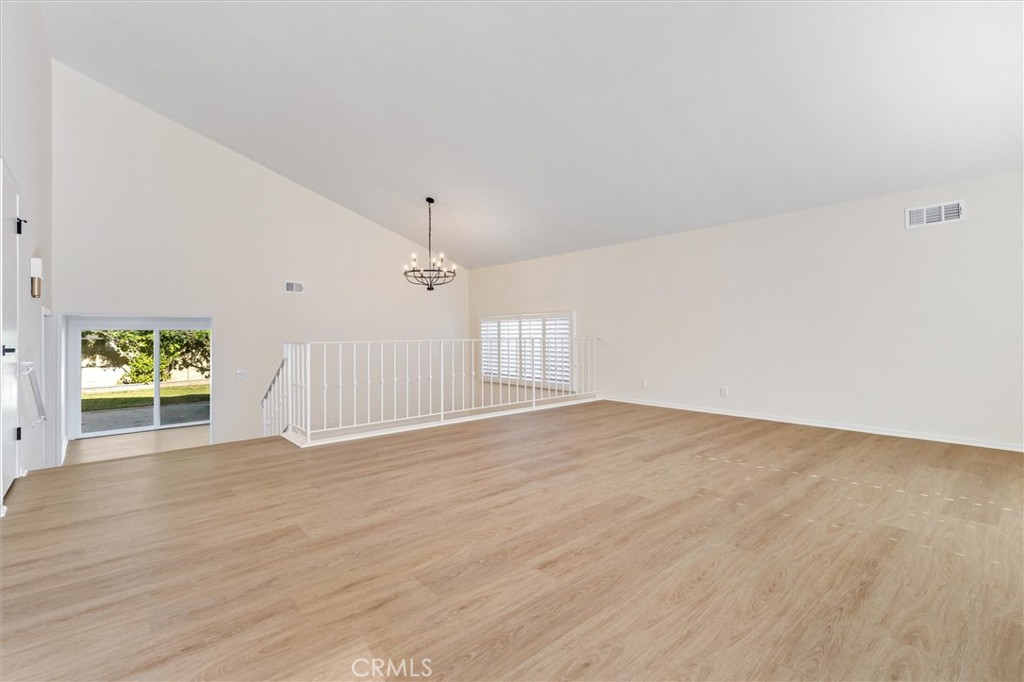 4533 Ironwood Avenue Seal Beach, CA 90740 - Photo 4 of 24 an empty room with wooden floor and windows