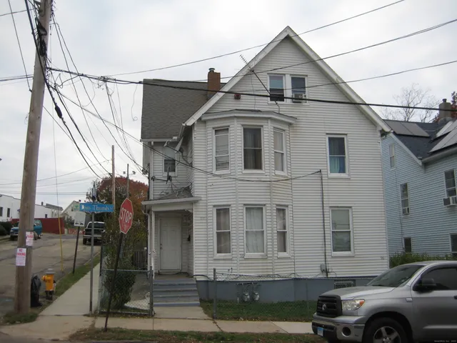 a front view of a house with parking