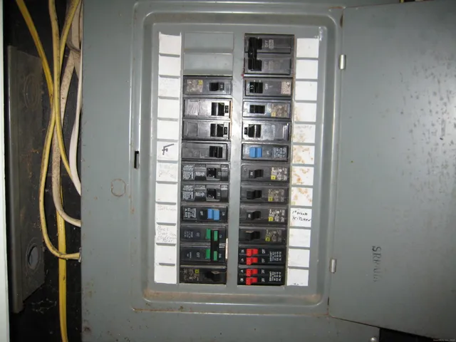 a close view of walk in closet with clothes and shoes