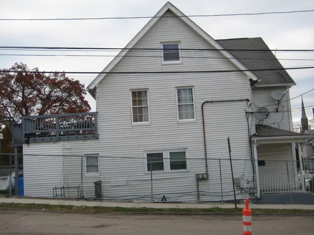 a view of a house with a street