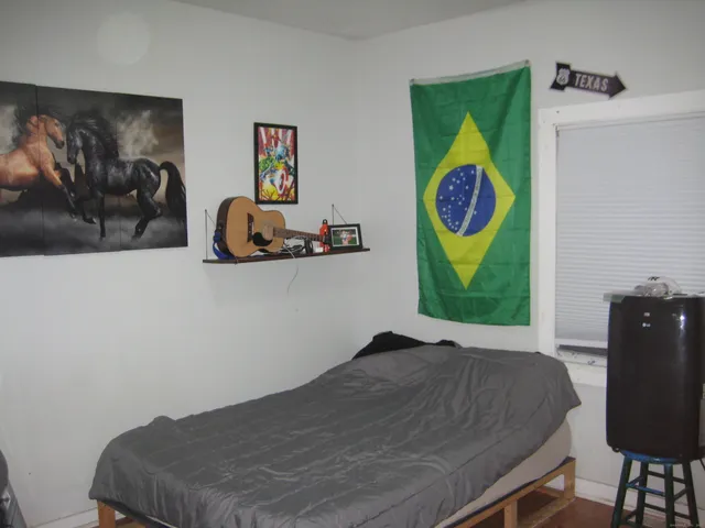 a bedroom with a bed and furniture