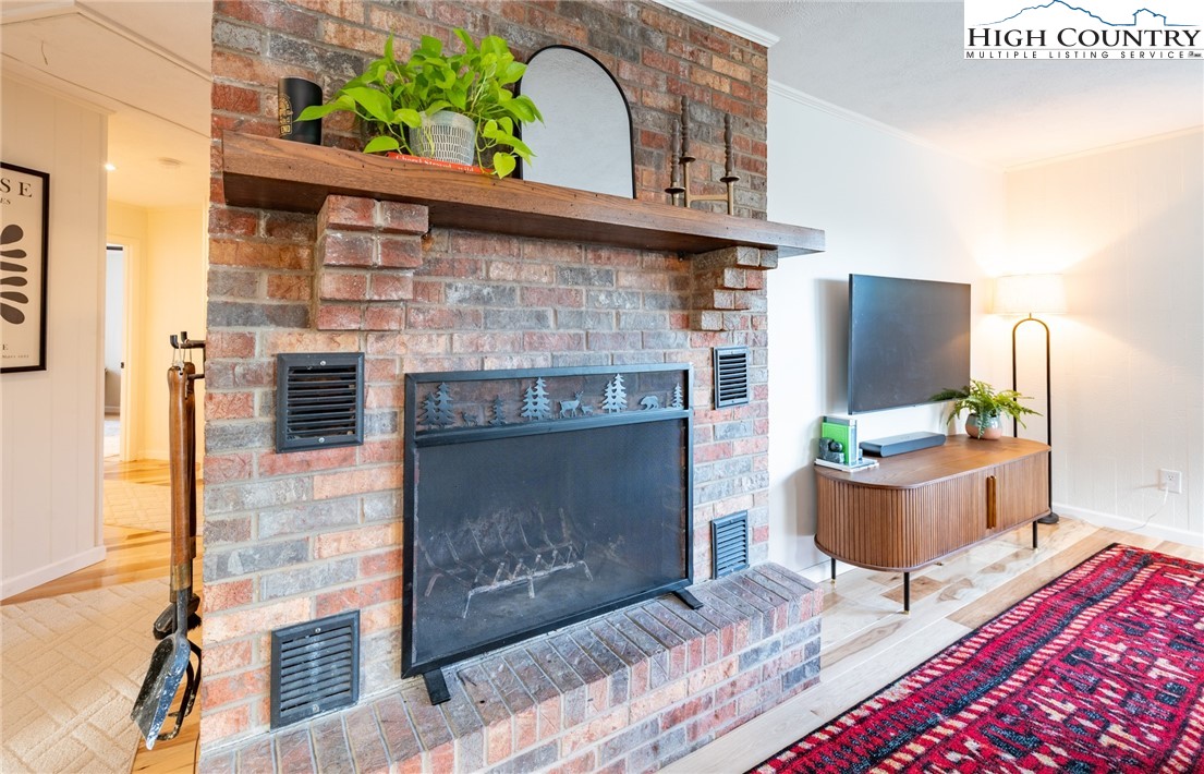 197 Sierra Vista Boone, NC 28607 - Photo 12 of 41 a living room with furniture and a fireplace