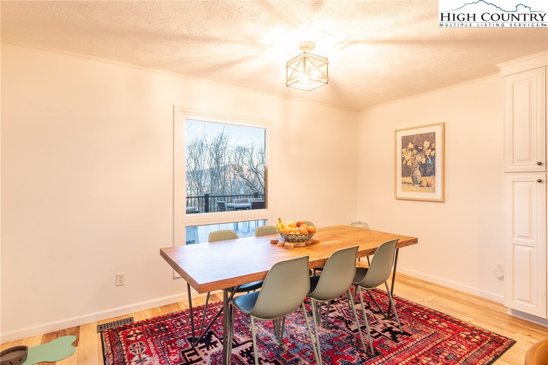 197 Sierra Vista Boone, NC 28607 - Photo 20 of 41 a view of a dining room with furniture and wooden floor