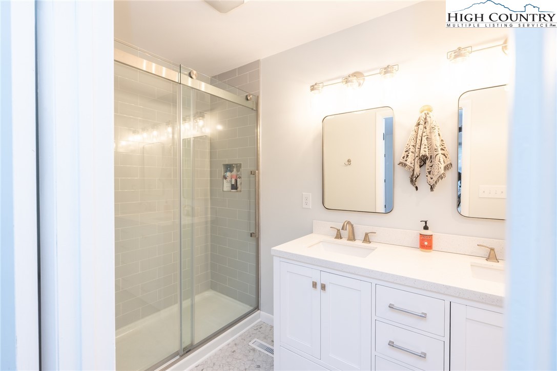 197 Sierra Vista Boone, NC 28607 - Photo 24 of 41 a bathroom with a shower sink and mirror
