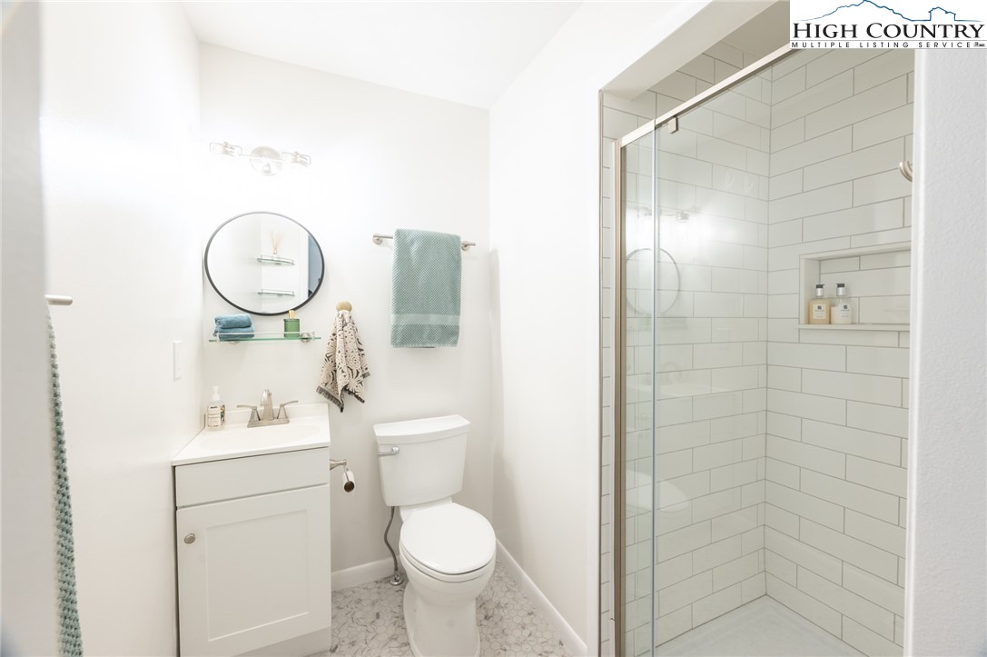 197 Sierra Vista Boone, NC 28607 - Photo 31 of 41 a bathroom with a toilet sink vanity and shower