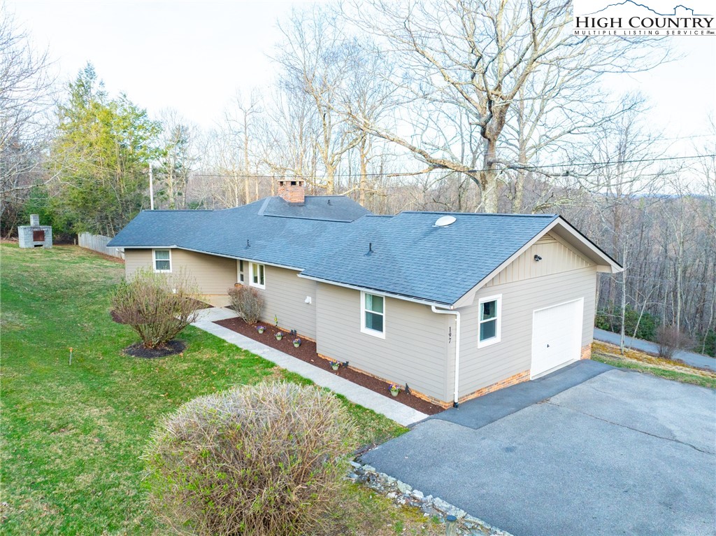 197 Sierra Vista Boone, NC 28607 - Photo 38 of 41 a front view of house with yard and trees in the background
