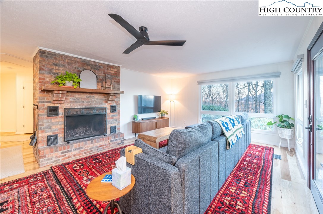 197 Sierra Vista Boone, NC 28607 - Photo 10 of 41 a living room with furniture and a fireplace