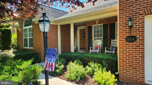 a view of a house that has a bunch of flowers in it