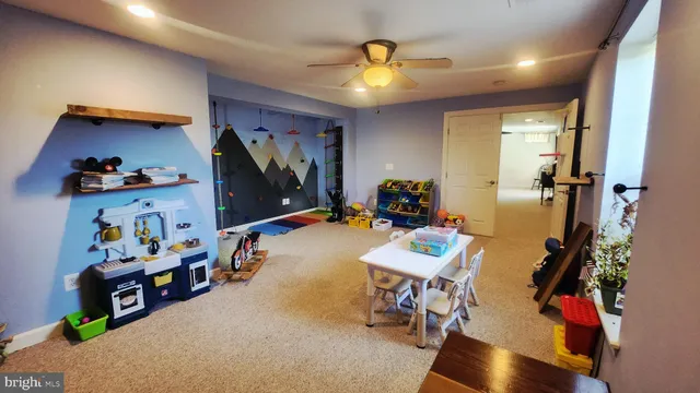 a view of storage and utility room with a hallway