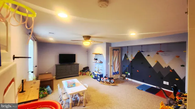 a view of storage and utility room with a hallway