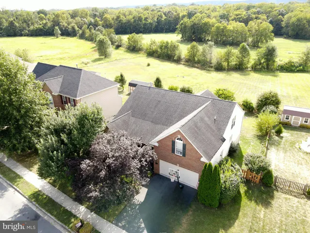 an aerial view of house with yard swimming pool and outdoor seating