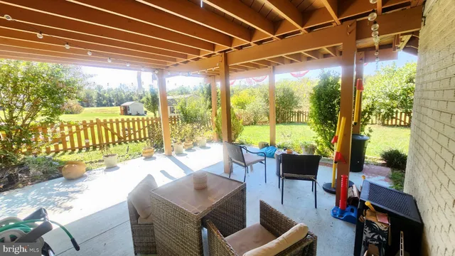 a front view of a house with yard and green space