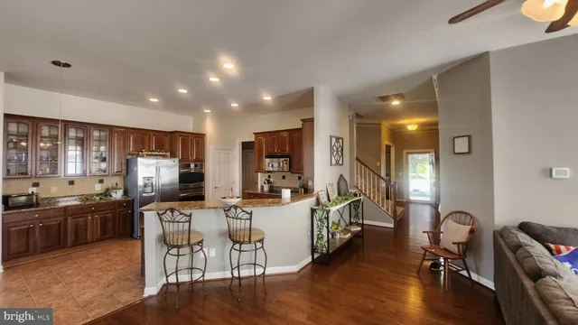 a large kitchen with a table and chairs
