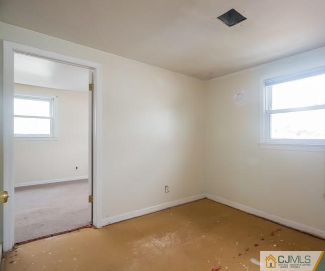 385 Florida Grove Road Perth Amboy, NJ 08861 - Photo 11 of 13 an empty room with a window