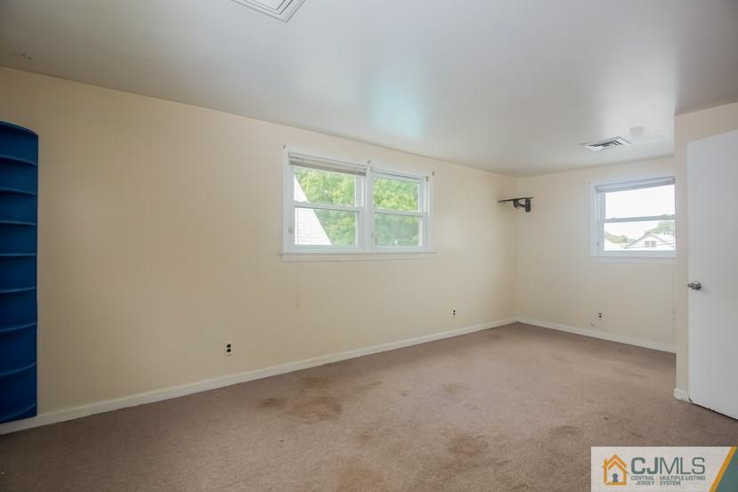385 Florida Grove Road Perth Amboy, NJ 08861 - Photo 12 of 13 an empty room with windows