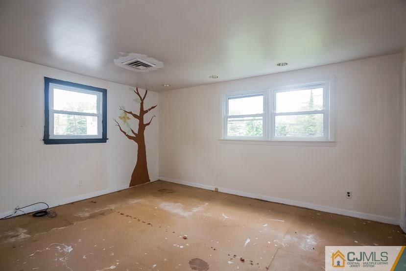 385 Florida Grove Road Perth Amboy, NJ 08861 - Photo 13 of 13 a view of an empty room with a window