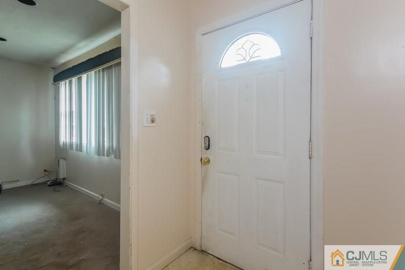 385 Florida Grove Road Perth Amboy, NJ 08861 - Photo 3 of 13 a view of entryway with window