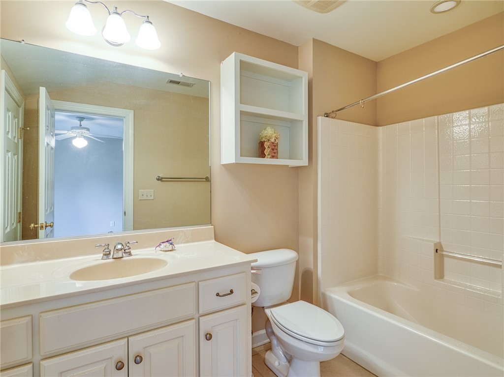 7914 O Neil Road Gloucester, VA 23061 - Photo 31 of 47 Bathroom with vanity, tub / shower combination, and light tile patterned floors