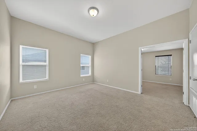 an empty room with windows