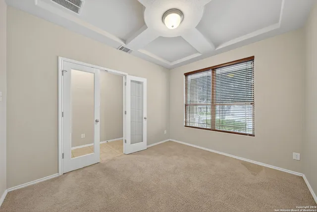 an empty room with a empty space and windows