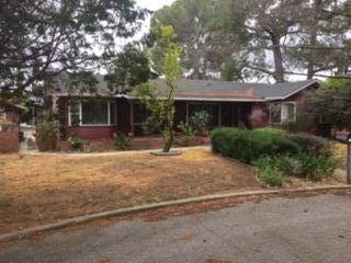 a house with trees in front of it