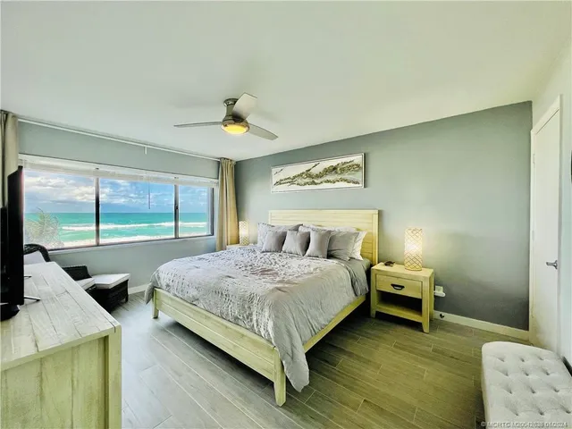 a bedroom with a bed and a table