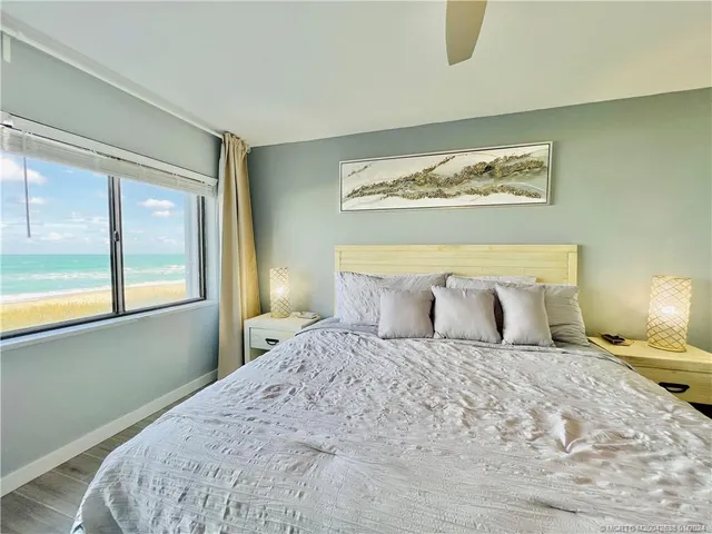 a bedroom with a large bed and a window