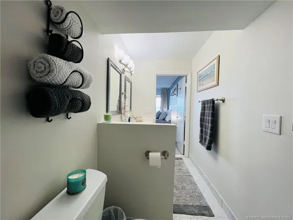 a bathroom with a toilet and washing machine