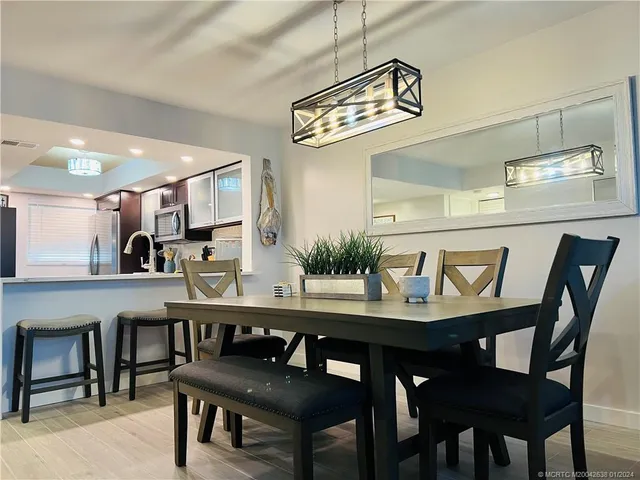 a view of a dining room and chairs