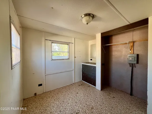 a view of empty room with closet