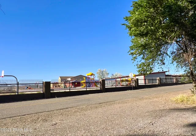 a view of a balcony with trees