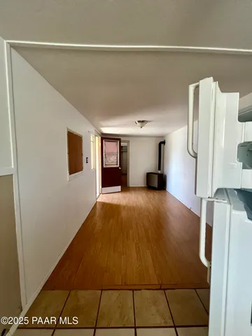 a room with a bed and a flat screen tv