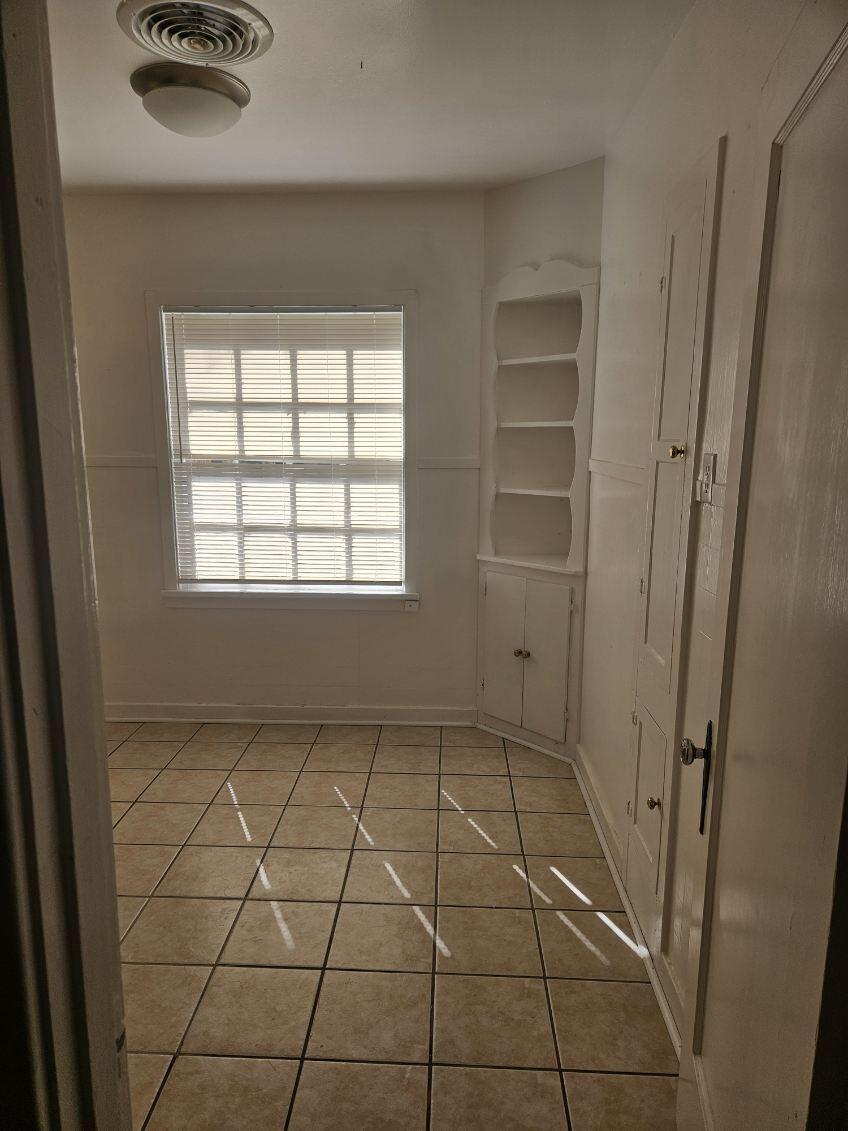 2205 25th Street, Unit FRONT Lubbock, TX 79411 - Photo 8 of 17 a view of an empty room and a window