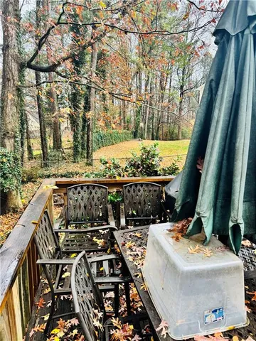 a view of balcony with wooden floor