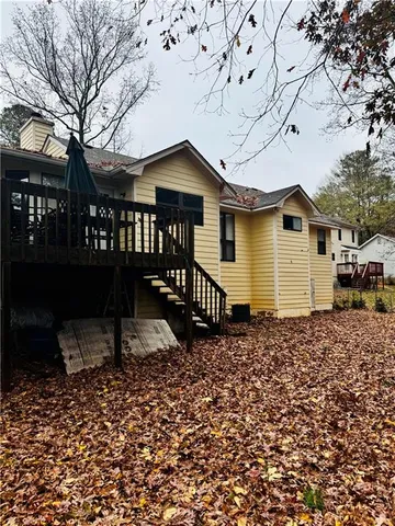 a backyard of a house with a bench