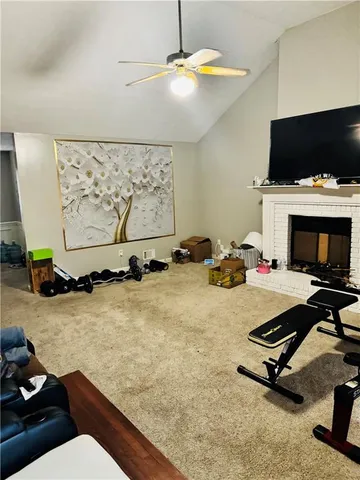 a room with gym equipment and a flat screen tv
