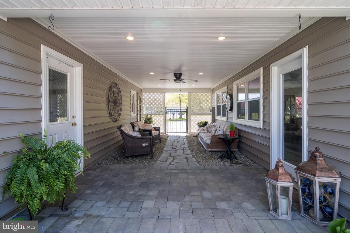 107 Jones Road Chester, MD 21619 - Photo 38 of 64 Breezeway to yard.