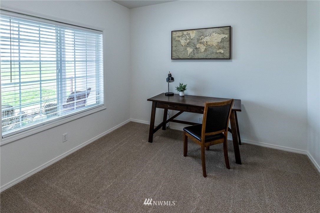 9147 Benson Road Lynden, WA 98264 - Photo 16 of 40 a bedroom with a bed and a window