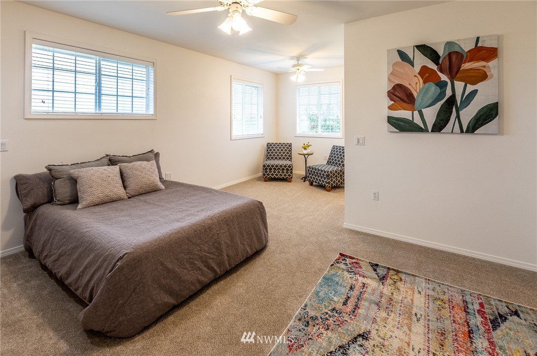 9147 Benson Road Lynden, WA 98264 - Photo 25 of 40 a bedroom with a bed and a window