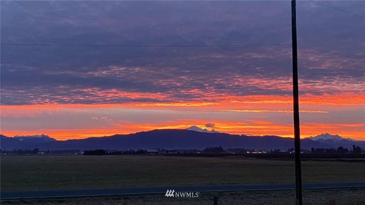 9147 Benson Road Lynden, WA 98264 - Photo 39 of 40 a view of mountain with sunset in background